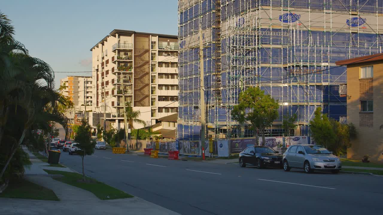 Apartment Building Under Construction at Sunset