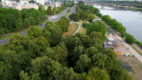 aerial view of a park by vistula river on poniatowski bridge in warsaw downtown