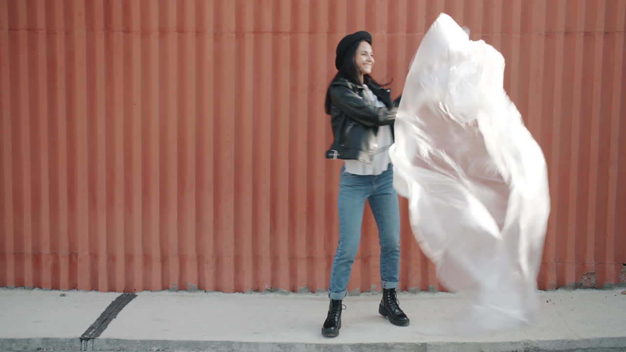 Fashionable Woman Dancing with Fabric