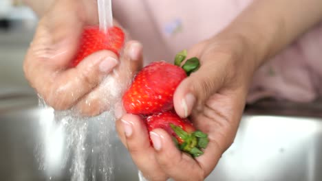 washing strawberries
