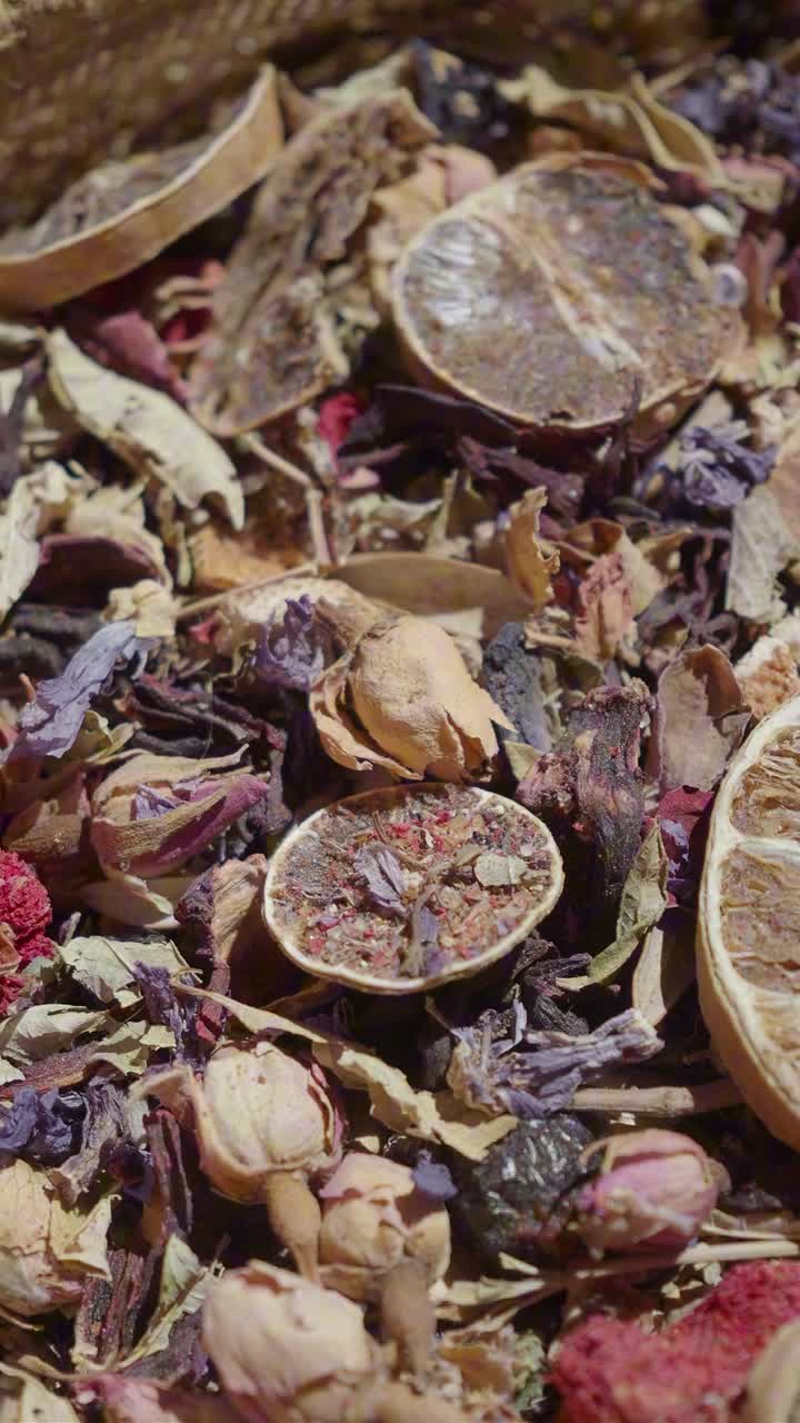 Close-up of Dried Lemon Slices, Flower Petals, and Herbs
