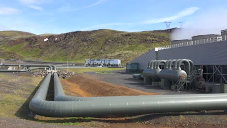 establishing shot of a geothermal power plant in iceland where clean electricity is generated