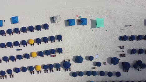 Miami-Florida-Aerial-view-Beach-service-chairs-and-umbrella-at-the-beach-resort-in-Destin,-Florida