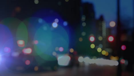 animación de puntos brillantes de luz sobre el fondo de la ciudad fuera de foco