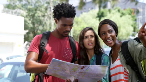 friends looking at map