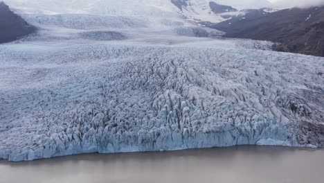 fjallsárlón frozen glacier in iceland, impressive grand ice mass, aerial