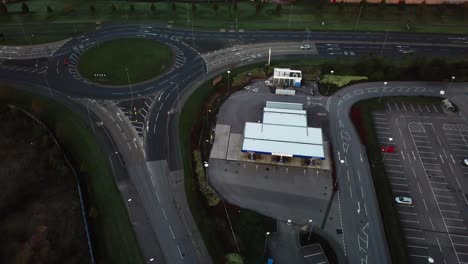 aerial moving towards roundabout with minimal morning traffic