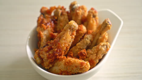 fried barbecue chicken wings in white bowl