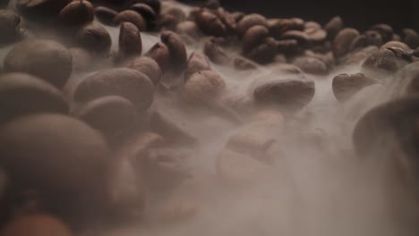 unique macro probe shot of roasting smoke over coffee beans