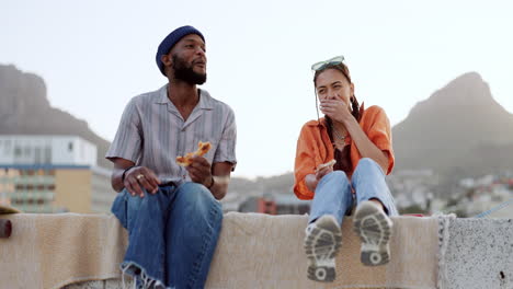 couple, pizza eating or laughing on city rooftop