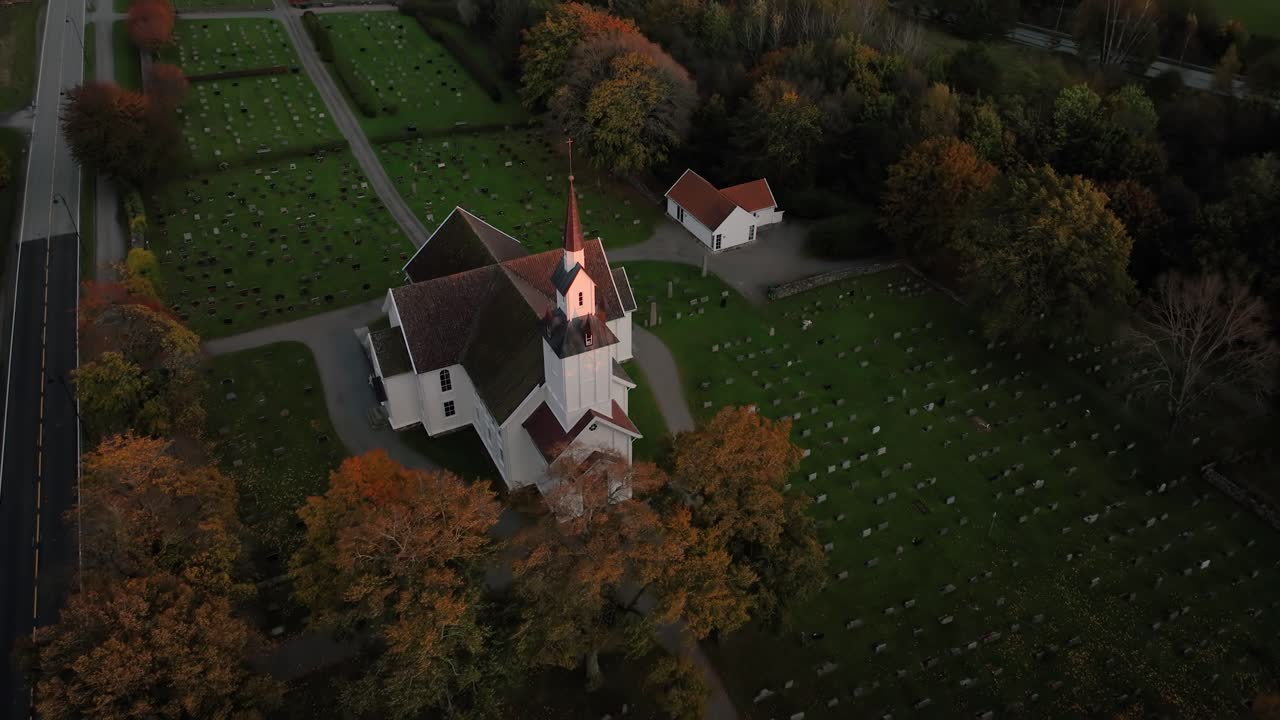 Aerial View of a Church and Cemetery in Autumn