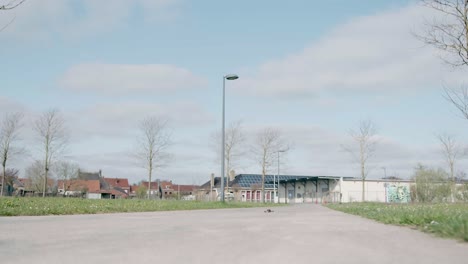 slow motion of an fvp drone sliding on the pavement