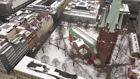 cinematic wide angle revolving aerial shot of famous and historical st clare church in central stockholm,sweden