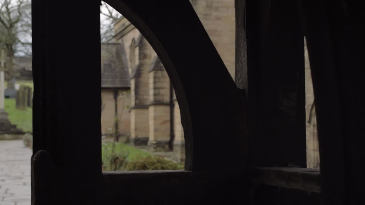 View through Lych Gate wooden church archway entrance