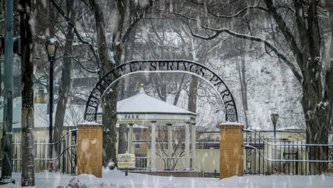 cinemagraph of the arch and gazebo of berkeley springs state park in west virginia while snowing