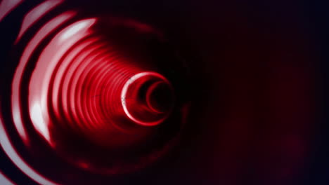 animación de círculos rojos brillantes que giran en el túnel