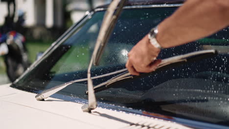 lifting up windshelf wipers on a sunny summer day in canada