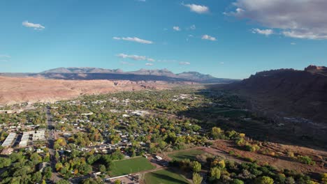 drone shot panning to the right of moab, utah with a mountain shadow