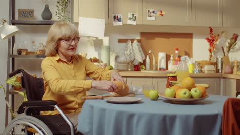 senior woman cutting bread