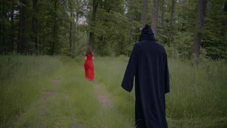 Reaper-Foloows-Woman-In-Forest