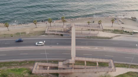 malaga, spain: pedestrian overpass bridge near the mediterranean shore