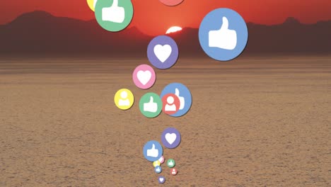 Animation-of-social-media-icons-over-sunset-and-sea-landscape