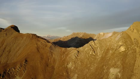 Overflying-mountain-pass-at-sunset