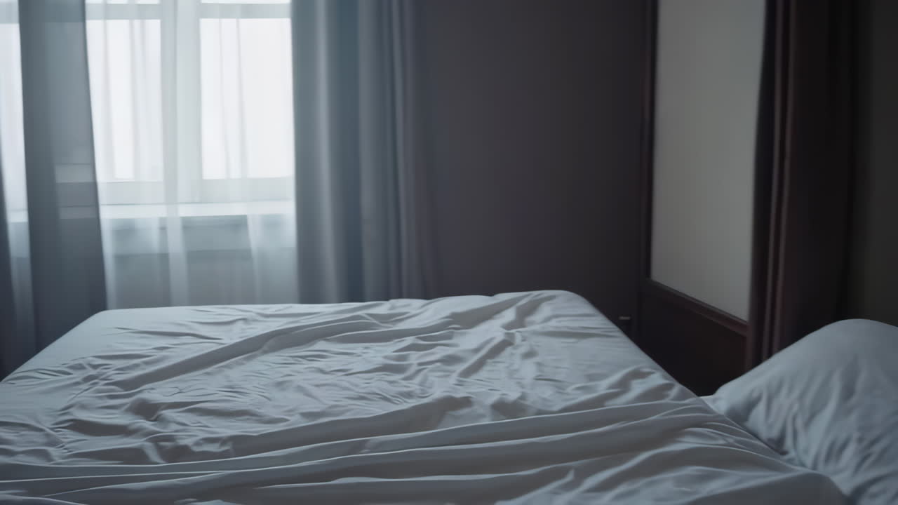 Empty Bed in a Hotel Room