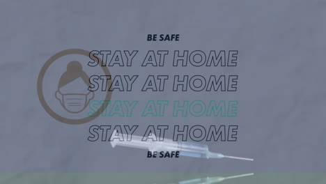 animation of stay at home with icon over syringe on white background