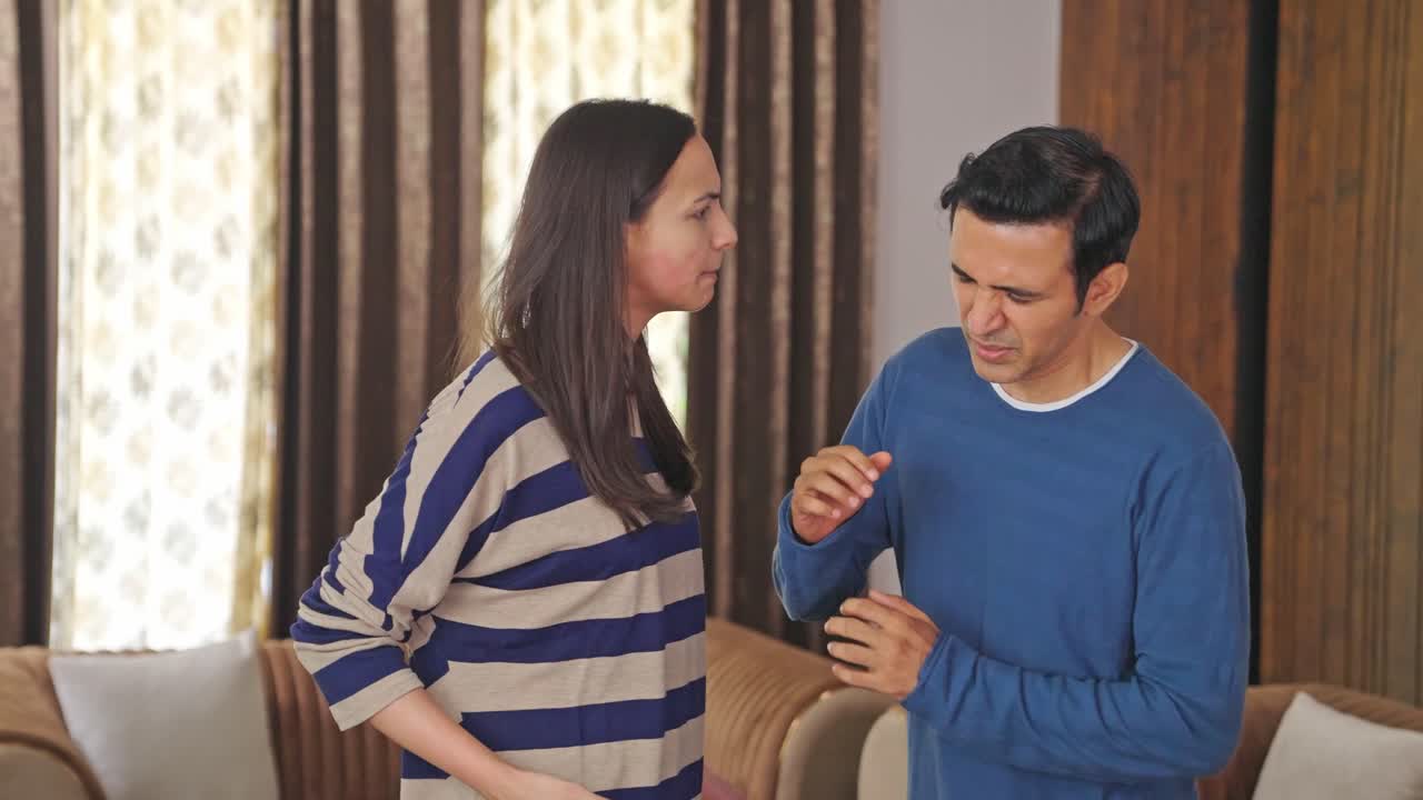 Indian wife beating her husband, domestic violence