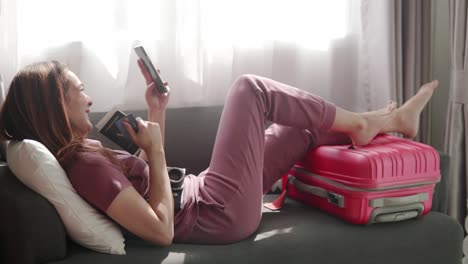 woman happy selfie portrait with her passport and credit card before travel trip