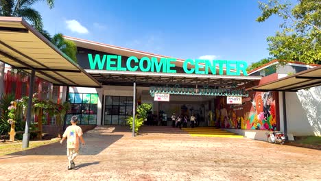 visitor approaches the zoo's welcome center