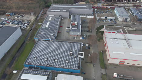 stunning aerial of industrial rooftops filled with solar panels