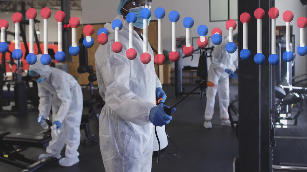 Disinfection team spraying gym machines, with animated spray icons floating above treadmills