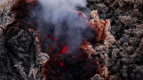 Smoldering lava with smoke at Etna, evoking powerful natural forces