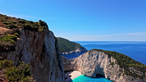 limestone cliffs with modern camera on tripod on the rocky viewpoint in zante, greece