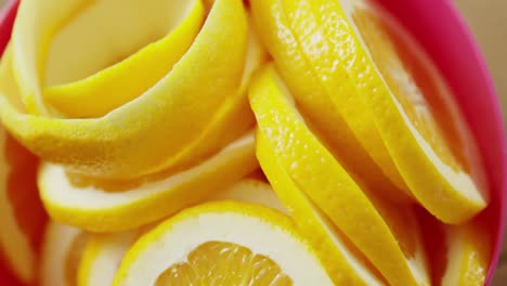 Halved-and-peel-sweet-limes-in-bowl