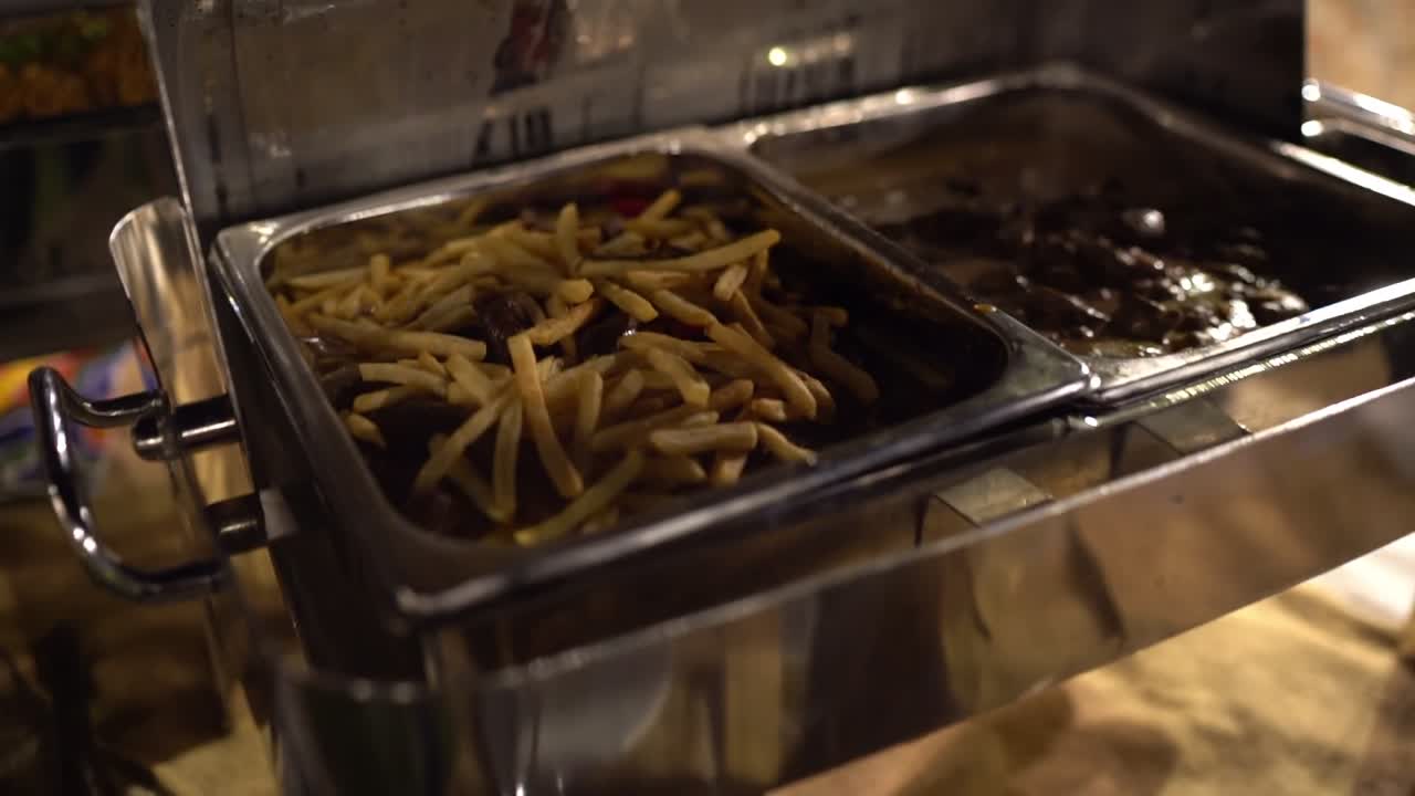 View of food in open buffet, close up shot, high angle shot