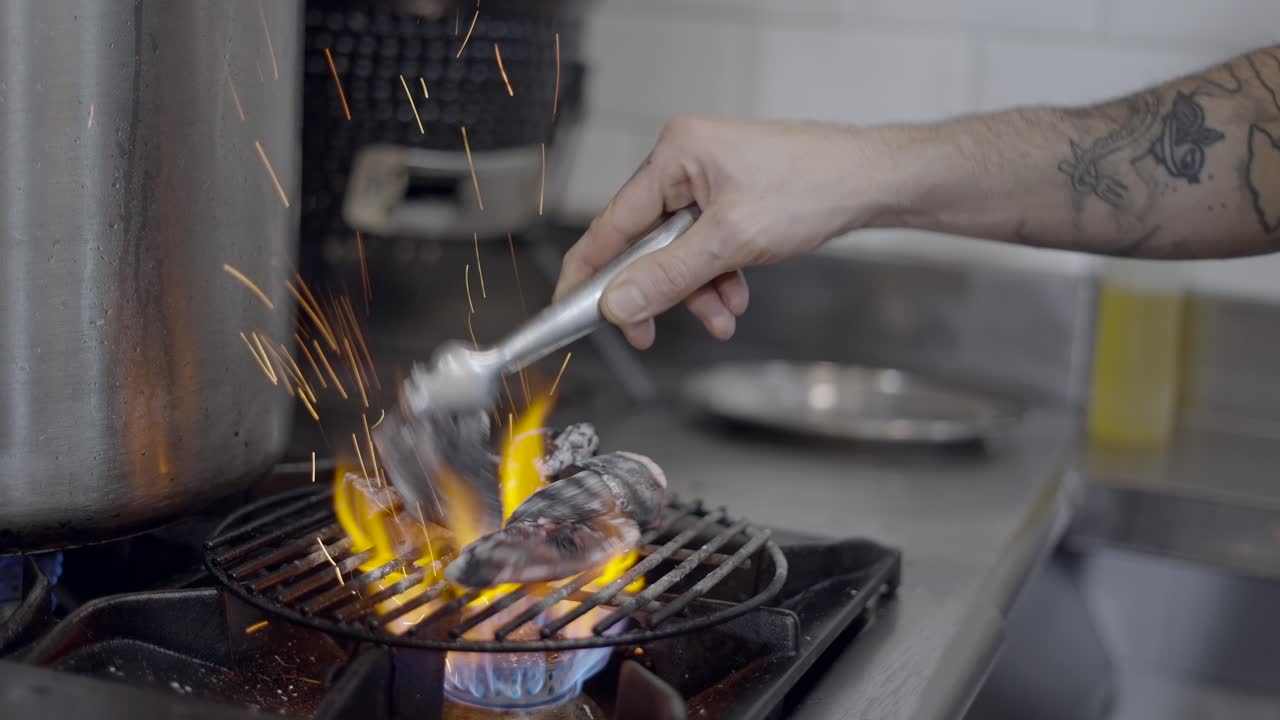 Chef preparing food with charcoal grill