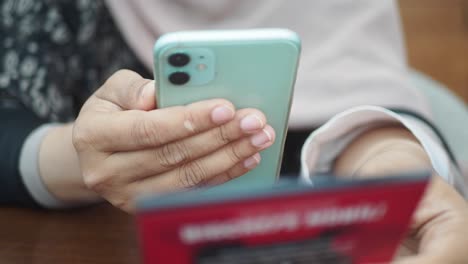 Person Using Smartphone for Online Transaction