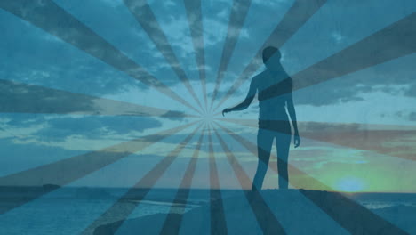 jumping joyfully, silhouette of person over sunburst pattern at sunset animation