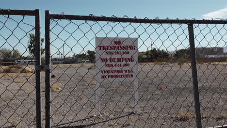 Empty lot with no trespassing sign