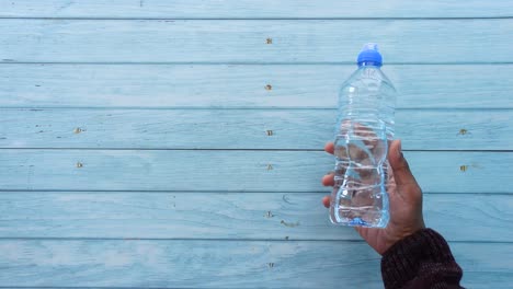 person holding a bottle of water