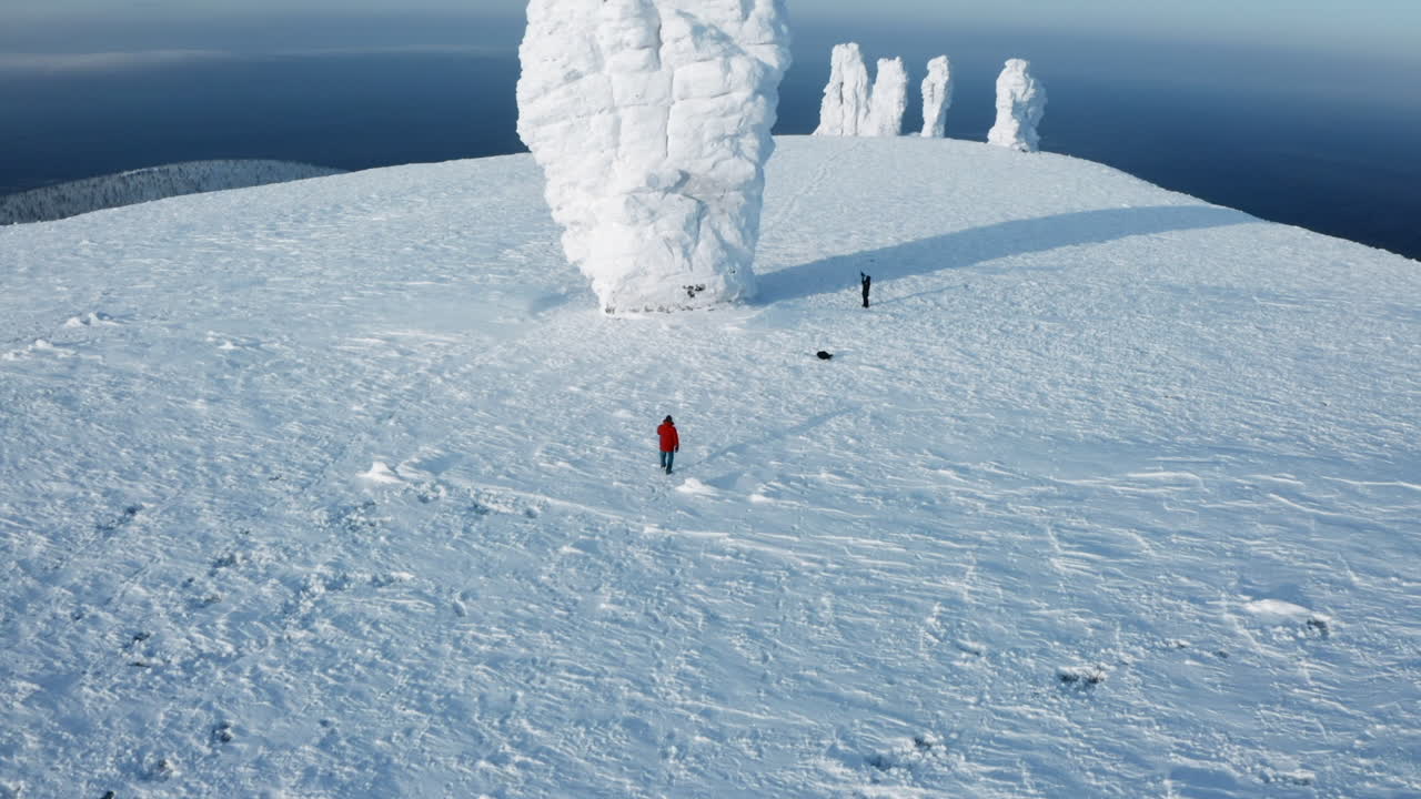 Winter Mountain Landscape with Ice Sculptures and Hikers