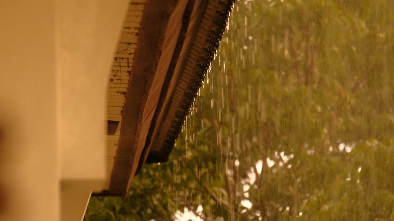 falling rain from the roof during raining season. feeling lonely