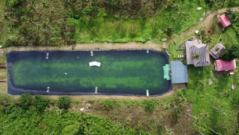 one rider wakeboarding on artificial lake at cable wake park of siargao