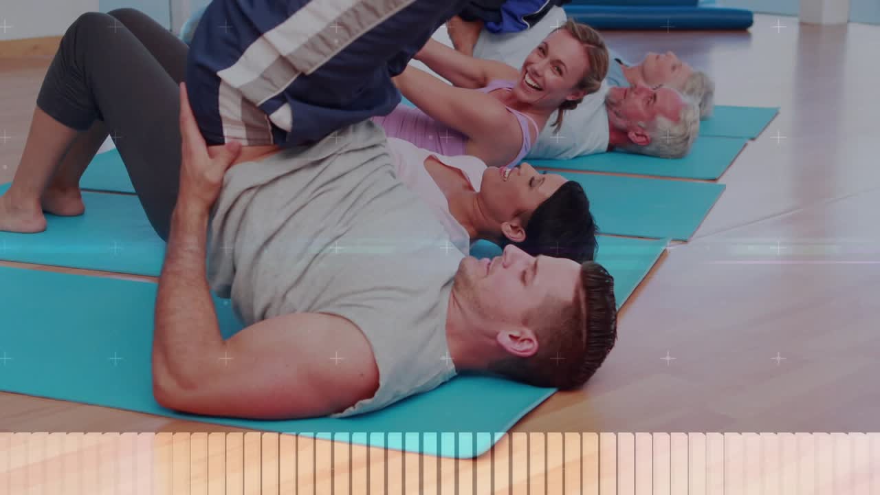 Front man lifting hips holding partner aiding fitness leg raises, data overlay partly hiding group