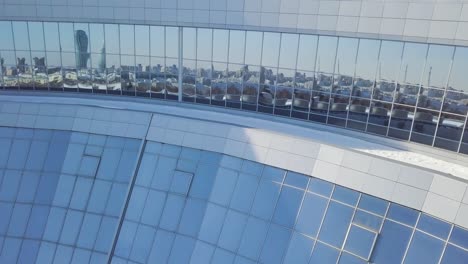 curved building with city reflection