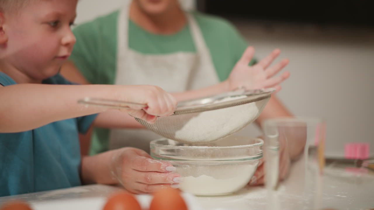 Child Learning to Bake with Parent