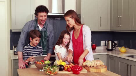 happy family preparing vegetables together